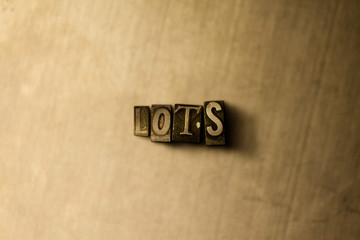 LOTS - close-up of grungy vintage typeset word on metal backdrop. Royalty free stock illustration.  Can be used for online banner ads and direct mail.