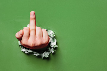 Middle finger through the wall hole