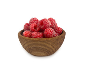 Raspberries in a wooden bowl isolated on white background. Raspberry close-up. Vegetarian or healthy eating. Juicy and delicious raspberries 