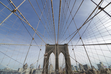 Perfect geometry of the Brooklyn Bridge cable web with overlook on Manhattan