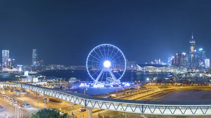 Fotobehang Ferris Wheel in Hong Kong City at night © leeyiutung