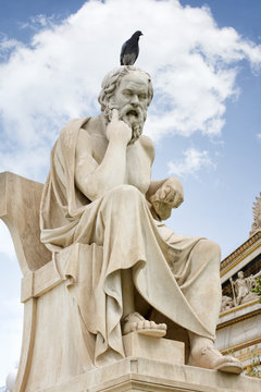 Statue of Socrates with a bird standing on his head at Academy Of Athens, Greece