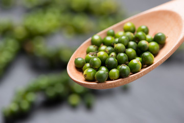 Fresh green pepper on dark background.