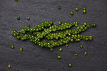 Fresh green pepper on dark background.