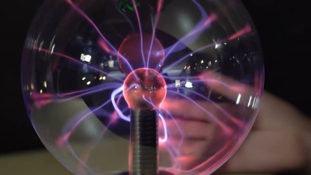 Boy playing with a Tesla generator