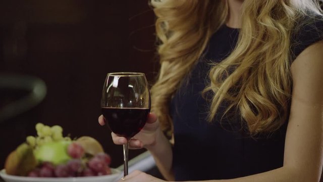 smiling cute lady drinking red wine