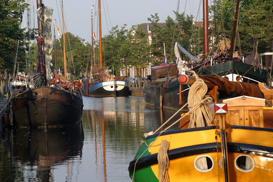 Old ships in canal Netherlands Meppel Drenthe. Historic barges. Boats. Grachtenfestival.