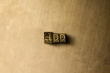 ADD - close-up of grungy vintage typeset word on metal backdrop. Royalty free stock illustration.  Can be used for online banner ads and direct mail.