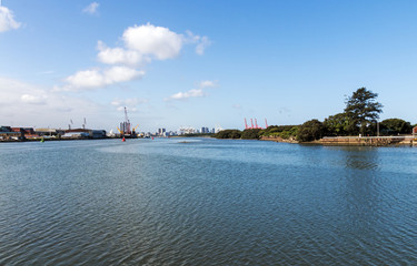 Fototapeta premium Blue Water Against Harbor and City Skyline in Durban