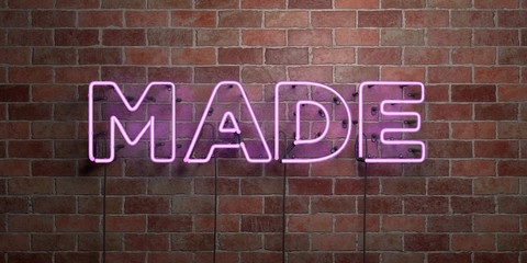 MADE - fluorescent Neon tube Sign on brickwork - Front view - 3D rendered royalty free stock picture. Can be used for online banner ads and direct mailers..