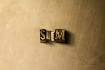 SLIM - close-up of grungy vintage typeset word on metal backdrop. Royalty free stock illustration.  Can be used for online banner ads and direct mail.