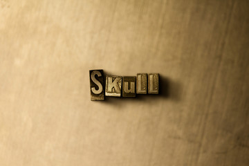 SKULL - close-up of grungy vintage typeset word on metal backdrop. Royalty free stock illustration.  Can be used for online banner ads and direct mail.