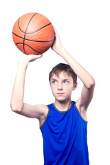 Teenager playing with a basketball. Isolated on white background