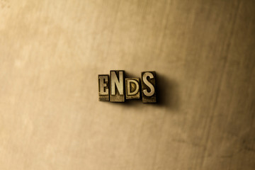ENDS - close-up of grungy vintage typeset word on metal backdrop. Royalty free stock illustration.  Can be used for online banner ads and direct mail.