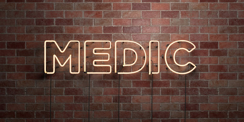 MEDIC - fluorescent Neon tube Sign on brickwork - Front view - 3D rendered royalty free stock picture. Can be used for online banner ads and direct mailers..