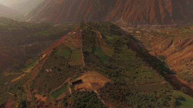 Peru Mountains Aerial v6 Flying down over moutnain hillsides towards San Jeronimo de Surco.