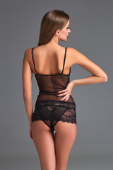 Fototapeta premium Beautiful brunette in black underwear
