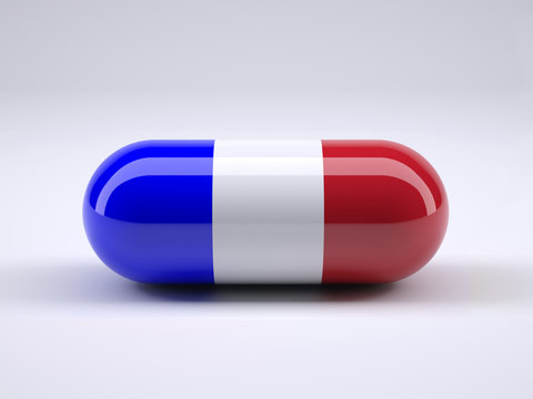 Pill with French flag wrapped around it and red ball inside