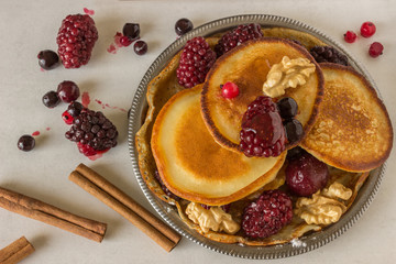 Homemade pancakes with berries and walnuts.