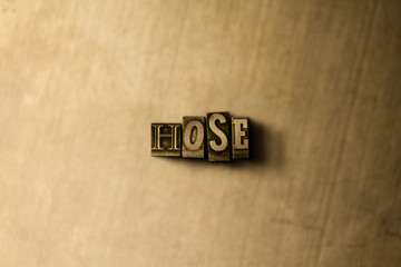 HOSE - close-up of grungy vintage typeset word on metal backdrop. Royalty free stock illustration.  Can be used for online banner ads and direct mail.