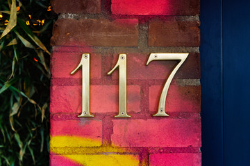Bronze house number on hundred and seventeen
