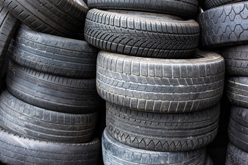 Tires for sale at a tire store - stacks of old used tires