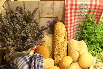 breadstuff, granary bread in the basket, ciabatta in the basket,bread rolls in the basket, oregano and bread in the basket