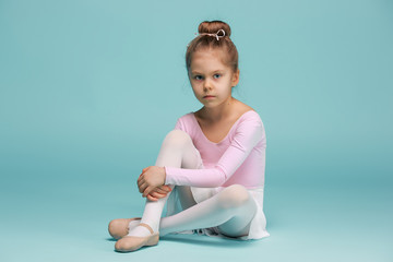 The little balerina dancer on blue background © master1305