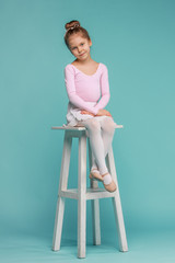 The little balerina dancer on blue background © master1305
