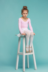 The little balerina dancer on blue background © master1305