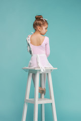 The little balerina dancer on blue background © master1305