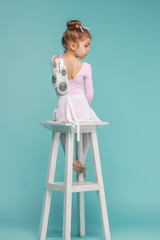 The little balerina dancer on blue background © master1305