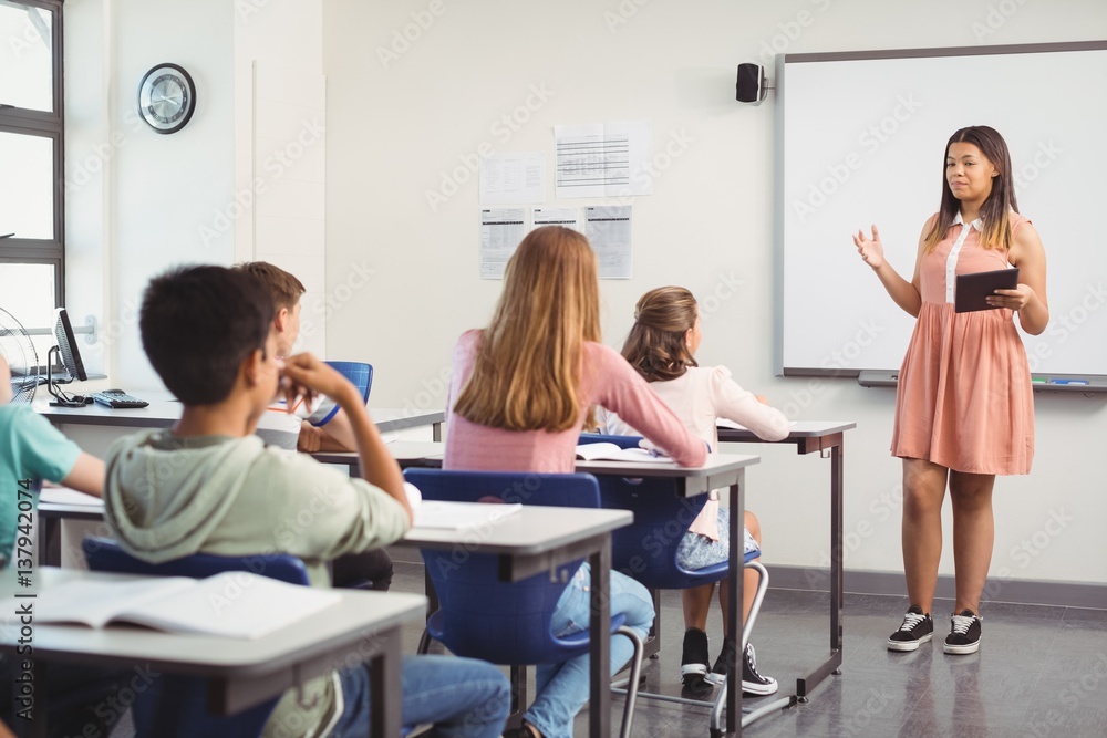 Wall mural schoolgirl giving presentation in classroom