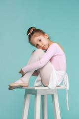 The little balerina dancer on blue background © master1305
