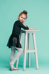 The little balerina dancer on blue background © master1305