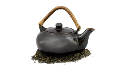 Foto op Aluminium Photo of a teapot with tea leaves underneath it. © evej