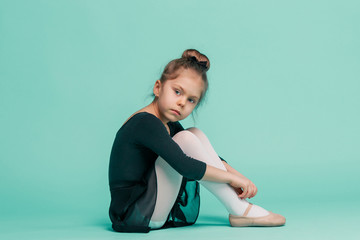 The little balerina dancer on blue background © master1305