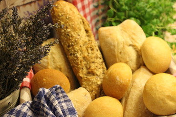 breadstuff, granary bread in the basket, ciabatta in the basket,bread rolls in the basket, oregano and bread in the basket