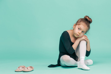 The little balerina dancer on blue background © master1305