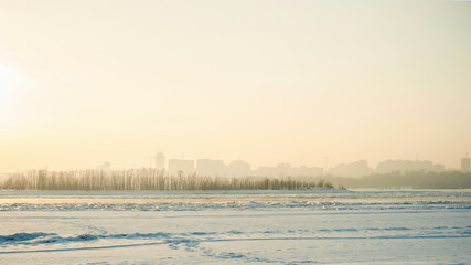 Fototapeta na wymiar ghostly blur urban architecture winter landscape on the horizon