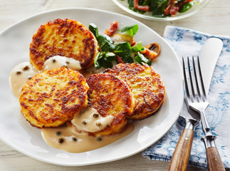Crisp Potato Pancakes in Cream Sauce with Salad