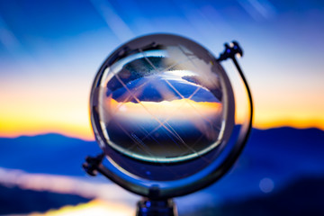 Crystal globe reflection cityscape inside