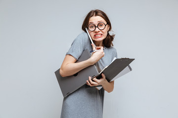 Guilty female nerd talking on phone