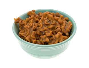 Marinara pasta in a small bowl isolated on a white background.