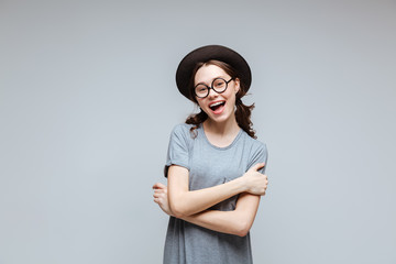 Happy Female nerd with crossed arms