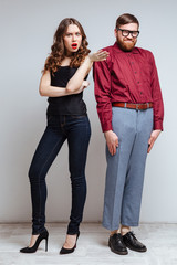 Vertical image of Pretty woman with Male nerd