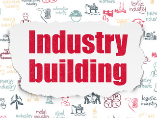 Manufacuring concept: Industry Building on Torn Paper background
