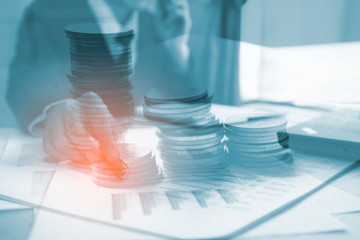 Double exposure of businessman working at office with step of coins. Concept business and finance