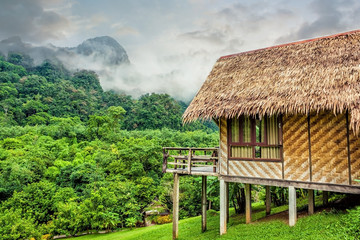 Fototapeta na wymiar Bamboo hut and forest hill