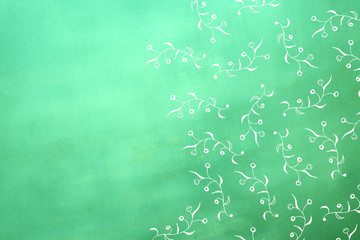 hand painted flower design on green textured background